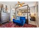Luxurious main bedroom with a four-poster bed, elegant furnishings, and an ensuite bathroom at 13088 N 91St Dr, Peoria, AZ 85381
