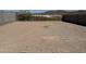 Spacious backyard with dirt area, perfect for creating your dream outdoor oasis at 13294 W Eagle Feather Rd, Peoria, AZ 85383