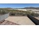 Wide shot of a large backyard with mountain views and perimeter fencing at 13294 W Eagle Feather Rd, Peoria, AZ 85383