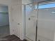 Modern bathroom featuring a glass-enclosed shower with sleek fixtures and tile surround at 13294 W Eagle Feather Rd, Peoria, AZ 85383