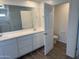 Bathroom with double sinks, and lots of storage, and tiled floors creates a clean, spa-like feel at 13294 W Eagle Feather Rd, Peoria, AZ 85383