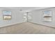 Spacious bedroom with neutral carpet, baseboards, and multiple bright windows at 13294 W Eagle Feather Rd, Peoria, AZ 85383