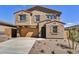 Two-story home with a two car garage, desert landscaping, and a concrete driveway at 13294 W Eagle Feather Rd, Peoria, AZ 85383