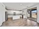 Modern kitchen with granite counters, stainless steel appliances, and a sliding glass door at 13294 W Eagle Feather Rd, Peoria, AZ 85383