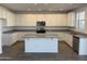 Bright kitchen with white cabinetry, granite countertops, and a stainless steel appliance package at 13294 W Eagle Feather Rd, Peoria, AZ 85383