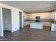 Spacious kitchen featuring an island, stainless steel appliances, white cabinets and granite countertops at 13294 W Eagle Feather Rd, Peoria, AZ 85383