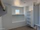 Walk-in closet complete with custom shelving and storage; it is a closet organizer's dream at 13294 W Eagle Feather Rd, Peoria, AZ 85383
