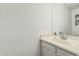 Clean bathroom highlighting a vanity with a sink and a well-lit mirror at 13750 W Roanoke Ave, Goodyear, AZ 85395