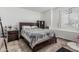 Bright bedroom featuring a decorative bed, carpet, and a ceiling fan at 13750 W Roanoke Ave, Goodyear, AZ 85395
