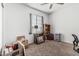 Well-lit bedroom showcasing carpet, natural light from the window, and ample space at 13750 W Roanoke Ave, Goodyear, AZ 85395