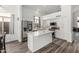 Modern kitchen showcasing stainless steel appliances, ample cabinet space, and a functional center island at 13750 W Roanoke Ave, Goodyear, AZ 85395