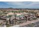 Stunning aerial view of community pool with lounging area and desert landscape at 16072 W Charlotte Dr, Surprise, AZ 85374