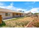 Expansive backyard boasts a covered patio, perfect for entertaining and relaxation at 16240 W Maricopa St, Goodyear, AZ 85338