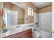 This bathroom features a single sink vanity, toilet, and bathtub shower combo at 16240 W Maricopa St, Goodyear, AZ 85338