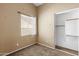 A cozy bedroom with closet and window; ideal for restful nights and peaceful mornings at 16240 W Maricopa St, Goodyear, AZ 85338