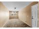 Bright bedroom with neutral carpet and walls, offering a versatile space for personalization at 16240 W Maricopa St, Goodyear, AZ 85338