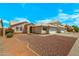 Inviting single-story home featuring desert landscaping, a two-car garage, and a welcoming entryway at 16240 W Maricopa St, Goodyear, AZ 85338