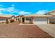Charming single-story home with a well-maintained front yard and a two-car garage at 16240 W Maricopa St, Goodyear, AZ 85338
