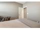 Bedroom offering a cozy atmosphere, plush carpeting, and an adjoining closet and workspace at 18023 W Statler St, Surprise, AZ 85388