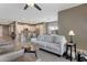 Inviting living room showcases a spacious layout, perfect for relaxation and entertaining, with kitchen in the background at 18023 W Statler St, Surprise, AZ 85388