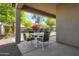 Covered patio featuring a table and chairs, perfect for outdoor dining and entertaining at 18023 W Statler St, Surprise, AZ 85388