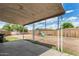 View of the spacious backyard with covered patio and playset, perfect for outdoor fun at 2308 W Marlette Ave, Phoenix, AZ 85015