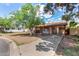 Charming single-story home with a covered carport, mature tree and mixed siding accents at 2308 W Marlette Ave, Phoenix, AZ 85015