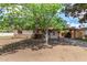 Charming single-story home with a covered carport, mature tree and mixed siding accents at 2308 W Marlette Ave, Phoenix, AZ 85015