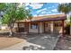 Charming single-story home with a covered carport, mature tree and mixed siding accents at 2308 W Marlette Ave, Phoenix, AZ 85015
