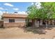 Charming single-story home with a covered carport, mature tree and mixed siding accents at 2308 W Marlette Ave, Phoenix, AZ 85015