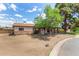 Charming single-story home with a covered carport, mature tree and mixed siding accents at 2308 W Marlette Ave, Phoenix, AZ 85015