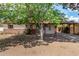 Charming single-story home with a covered carport, mature tree and mixed siding accents at 2308 W Marlette Ave, Phoenix, AZ 85015