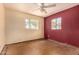 Bedroom features ceiling fan and windows for natural light at 2308 W Marlette Ave, Phoenix, AZ 85015