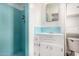 Bathroom with blue tile in shower and vanity area at 2308 W Marlette Ave, Phoenix, AZ 85015