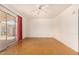 Spacious living room with sliding glass door, ceiling fan, and polished concrete floors at 2308 W Marlette Ave, Phoenix, AZ 85015