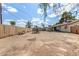 Expansive dirt backyard with a playset and views of the house's rear facade at 2308 W Marlette Ave, Phoenix, AZ 85015