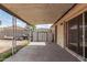Covered back patio with storage shed and sliding glass door access to the home at 2308 W Marlette Ave, Phoenix, AZ 85015