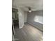 Bedroom with fan, vinyl floors, natural light, and adjoining bathroom at 29 W Southern Ave # 28, Mesa, AZ 85210