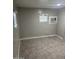 Bedroom with vinyl floors and natural light, equipped with an AC unit at 29 W Southern Ave # 28, Mesa, AZ 85210
