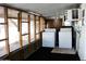 Functional laundry area equipped with a washer, dryer, and a window air conditioner unit at 29 W Southern Ave # 28, Mesa, AZ 85210
