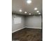Bright living room with recessed lights and wood-look flooring creates a stylish and comfortable atmosphere at 29 W Southern Ave # 28, Mesa, AZ 85210