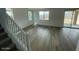 Spacious living room featuring lots of light, modern staircase and sliding doors to backyard at 37568 W Patterson St, Maricopa, AZ 85138