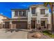Charming two-story home with a three car garage, desert landscaping, and inviting curb appeal at 45247 W Jack Rabbit Trl, Maricopa, AZ 85139