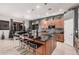 Stylish kitchen boasts granite counters, stainless appliances, and large island with seating at 45247 W Jack Rabbit Trl, Maricopa, AZ 85139