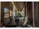 Covered patio area with dining table, chairs, and backyard views, perfect for outdoor entertaining and relaxation at 45247 W Jack Rabbit Trl, Maricopa, AZ 85139