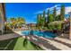 Stunning backyard oasis with a sparkling pool, mature landscaping, and a detached cabana for ultimate relaxation at 45247 W Jack Rabbit Trl, Maricopa, AZ 85139