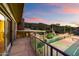 Upstairs balcony overlooking a tennis court and backyard pool area with mountain views at 4744 E Foothill Dr, Paradise Valley, AZ 85253