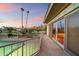 Spacious balcony overlooking tennis court with scenic views and desert landscape at sunset at 4744 E Foothill Dr, Paradise Valley, AZ 85253