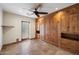 Bedroom with built-in wooden storage, travertine flooring, and door to the outside at 4744 E Foothill Dr, Paradise Valley, AZ 85253