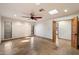 Large bedroom with tile floor, ceiling fan with lights, recessed lights, skylight, and window with backyard view at 4744 E Foothill Dr, Paradise Valley, AZ 85253
